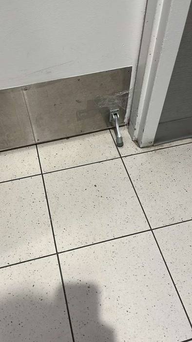 Mobile locksmith repairing commercial lock cylinder